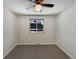 Spacious bedroom with ceiling fan and neutral carpeting at 1772 Robb St, Lakewood, CO 80215