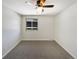 Well-lit bedroom with ceiling fan and neutral carpeting at 1772 Robb St, Lakewood, CO 80215