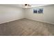 Bright and airy bedroom with neutral colored carpet at 1772 Robb St, Lakewood, CO 80215