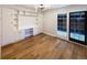 Bright dining area with built-in shelving and access to the patio at 1772 Robb St, Lakewood, CO 80215