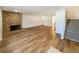 Spacious living room with hardwood floors and a brick fireplace at 1772 Robb St, Lakewood, CO 80215