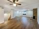 Bright living room with hardwood floors, fireplace, and access to upper level at 1772 Robb St, Lakewood, CO 80215