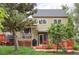 Backyard view of a home featuring a deck, hot tub and mature landscaping at 11502 W 101St Avenue, Westminster, CO 80021