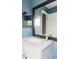 Bathroom features a modern sink and vanity with a large framed mirror at 11502 W 101St Avenue, Westminster, CO 80021