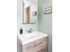 Bathroom featuring a modern vanity with a white countertop and decorative owl art at 11502 W 101St Avenue, Westminster, CO 80021