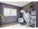 Light-filled bedroom with a large window, chair, and decorative shelving unit at 11502 W 101St Avenue, Westminster, CO 80021