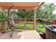 Relaxing covered deck boasts a hanging chair and hot tub for ultimate comfort and outdoor enjoyment at 11502 W 101St Avenue, Westminster, CO 80021