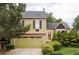 Charming two-story home featuring a well-manicured front yard and attached two-car garage at 11502 W 101St Avenue, Westminster, CO 80021