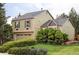 Exterior view of a two-story home with verdant landscaping and a partial view of the side yard at 11502 W 101St Avenue, Westminster, CO 80021