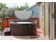 Exterior view of an above ground hot tub on a deck with a safety cover for relaxation and comfort at 11502 W 101St Avenue, Westminster, CO 80021