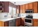 Updated kitchen featuring stainless steel appliances, white countertops, and wood cabinets at 11502 W 101St Avenue, Westminster, CO 80021