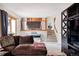 Open-concept living room features a comfortable brown couch and a staircase at 11502 W 101St Avenue, Westminster, CO 80021