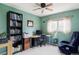 Bright office with a bookcase, a modern desk, and comfortable looking chair at 11502 W 101St Avenue, Westminster, CO 80021