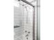 Modern shower with white subway tile and glass door, complete with chrome fixtures at 11502 W 101St Avenue, Westminster, CO 80021