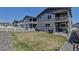 A view of multiple backyards with grill, patio, and deck at 3953 John Ave, Castle Rock, CO 80104