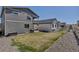 A view of multiple backyards with grill, patio, and deck at 3953 John Ave, Castle Rock, CO 80104