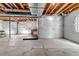 Unfinished basement offering open layout, roughed-in plumbing, egress windows, and exposed ceilings and insulation at 3953 John Ave, Castle Rock, CO 80104