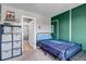Charming bedroom showcasing sporty-themed decor and comfortable layout at 3953 John Ave, Castle Rock, CO 80104