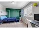 Bedroom with natural light, complemented by a stylish desk and chair at 3953 John Ave, Castle Rock, CO 80104