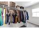 Walk-in closet featuring ample hanging space, shelving, and storage baskets at 3953 John Ave, Castle Rock, CO 80104