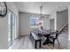 Bright dining area with a rustic table set for a formal meal at 3953 John Ave, Castle Rock, CO 80104