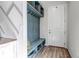 Charming entryway with built-in storage bench and coat hooks at 3953 John Ave, Castle Rock, CO 80104