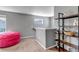 Upstairs hallway showcasing neutral decor, with a cozy seating area and a bookshelf at 3953 John Ave, Castle Rock, CO 80104