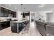 Spacious kitchen featuring a large island, granite counters and stainless appliances at 3953 John Ave, Castle Rock, CO 80104
