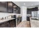 Modern kitchen with stainless appliances, granite countertops, and ample cabinet space at 3953 John Ave, Castle Rock, CO 80104