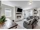 Inviting living room with a cozy fireplace and modern decor at 3953 John Ave, Castle Rock, CO 80104
