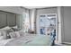 Comfortable main bedroom showcasing a balcony, a side table, and a peaceful ambiance at 3953 John Ave, Castle Rock, CO 80104