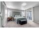 Inviting main bedroom featuring a headboard accent wall, bedside tables, and a sliding door to a deck at 3953 John Ave, Castle Rock, CO 80104