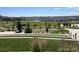 Scenic view of the neighborhood park, complete with manicured lawns, walking paths, and lush greenery, inviting community at 3953 John Ave, Castle Rock, CO 80104
