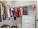 Organized walk-in closet with hanging clothes, drawers, and shelves offering ample storage space at 3953 John Ave, Castle Rock, CO 80104