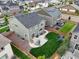 Aerial view of the property showcasing a lush green lawn, patio, and fenced yard at 652 Pinecliff Dr, Erie, CO 80516