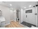 Modern bathroom featuring a glass-enclosed shower with sleek black fixtures and subway tile at 652 Pinecliff Dr, Erie, CO 80516