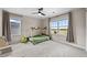Bright bedroom featuring a unique bed frame, large windows, and a picturesque view at 652 Pinecliff Dr, Erie, CO 80516