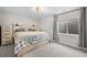 Serene bedroom featuring a stylish bed frame, bedside tables, and cozy bedding at 652 Pinecliff Dr, Erie, CO 80516