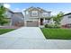 Charming two-story home with a well-manicured lawn, covered porch, and two car garage at 652 Pinecliff Dr, Erie, CO 80516
