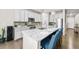 Modern kitchen with stainless steel appliances, stylish countertops, and a center island with seating at 652 Pinecliff Dr, Erie, CO 80516
