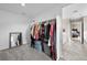 Spacious walk-in closet with ample storage, connected to the Primary bathroom at 652 Pinecliff Dr, Erie, CO 80516