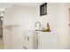 The wet bar features white cabinetry with gold hardware and a modern faucet at 4656 Tanglewood Trl, Boulder, CO 80301