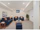 Finished basement boasts neutral carpet, recessed lighting, and comfortable seating with vibrant colors at 4656 Tanglewood Trl, Boulder, CO 80301
