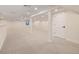 Spacious finished basement featuring neutral carpet, recessed lighting, with a partial wall and support beams at 4656 Tanglewood Trl, Boulder, CO 80301