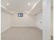 Unfinished basement featuring neutral carpet, recessed lighting, and natural light from a small window at 4656 Tanglewood Trl, Boulder, CO 80301