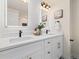 Bright bathroom with double vanity, sleek black faucets, and modern lighting fixtures at 4656 Tanglewood Trl, Boulder, CO 80301