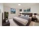 Comfortable bedroom with a large bed, stylish decor, and view of outside at 4656 Tanglewood Trl, Boulder, CO 80301