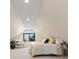 A cozy bedroom features an angled ceiling with a bed and sitting area at 4656 Tanglewood Trl, Boulder, CO 80301