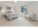 Bright bedroom with neutral tones, large window, and comfortable seating area at 4656 Tanglewood Trl, Boulder, CO 80301