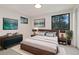 Beautiful main bedroom with a plush rug, modern furniture, and serene natural light at 4656 Tanglewood Trl, Boulder, CO 80301